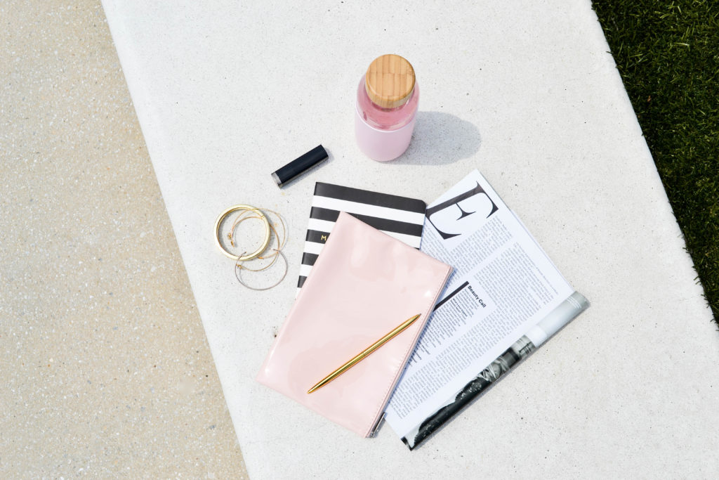 black white and pink planning tools and magazine