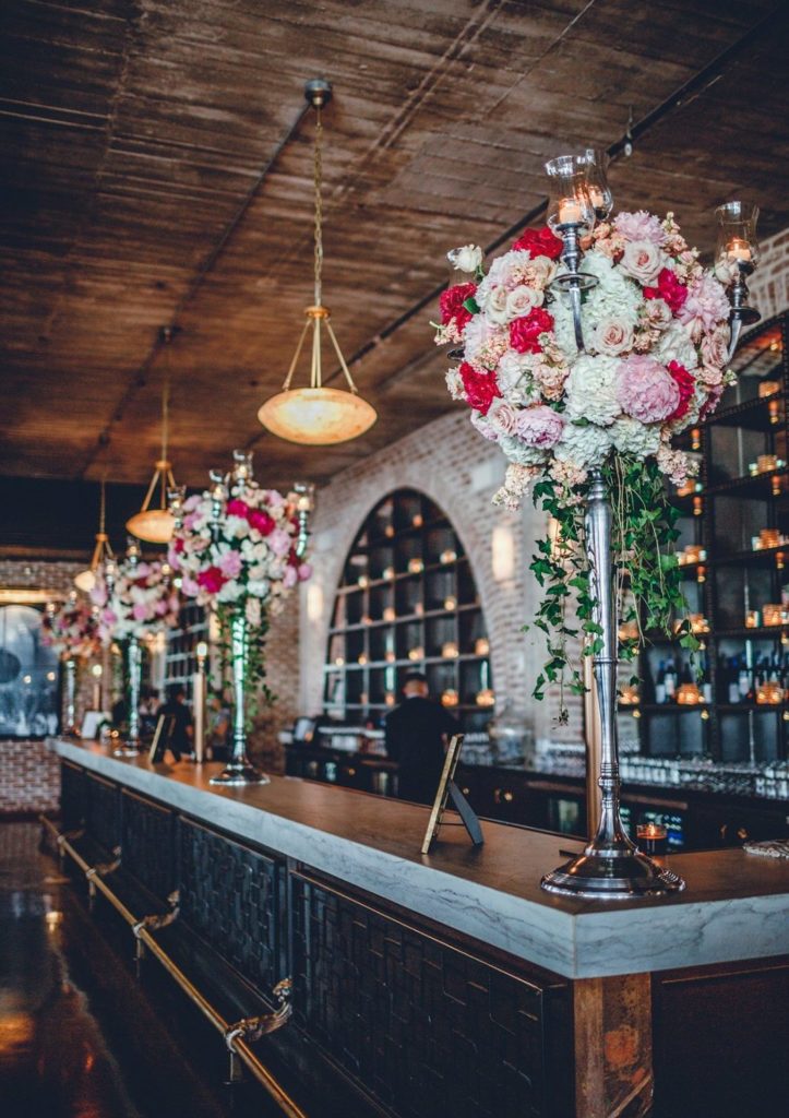 Bar decorated with flowers at The Astorian