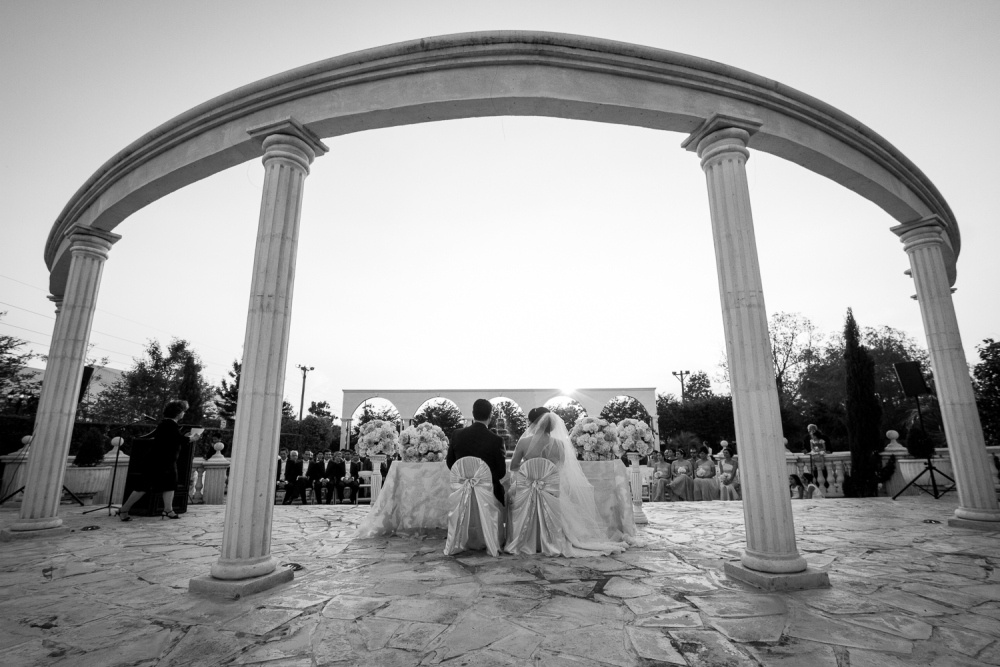 Black and white outdoor wedding photo of couple at Safari Texas Ranch