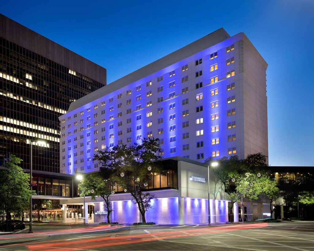Exterior nighttime view of Whitehall Hotel in Houston