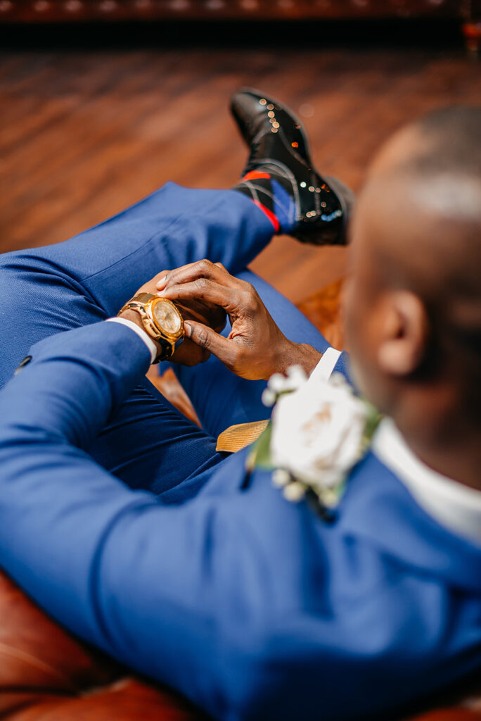 wedding groom checking the time