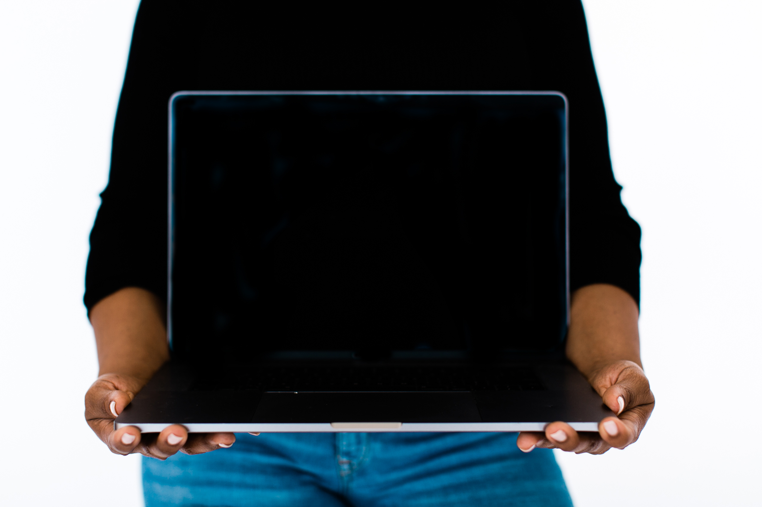 woman holding laptop