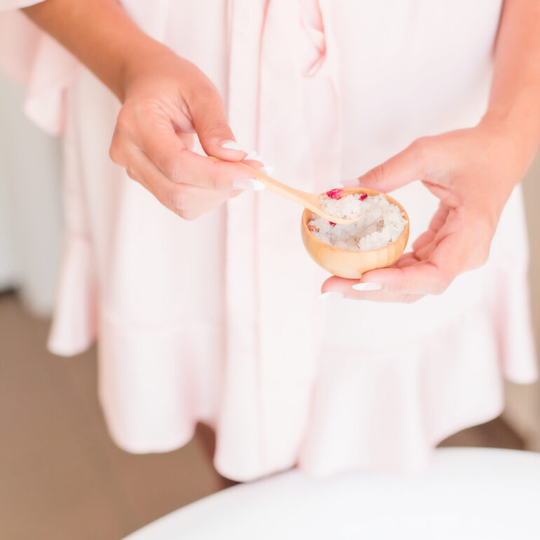 woman holding spa essentials